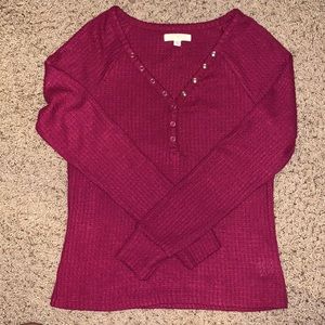 Maroon long sleeve. V-neck.